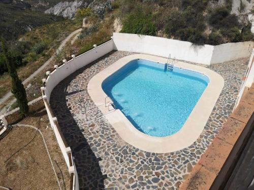 Swimmingpoolen hos eller tæt på House alpujarra caratunas