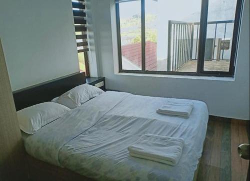 Giường trong phòng chung tại Carrot Creek Resorts