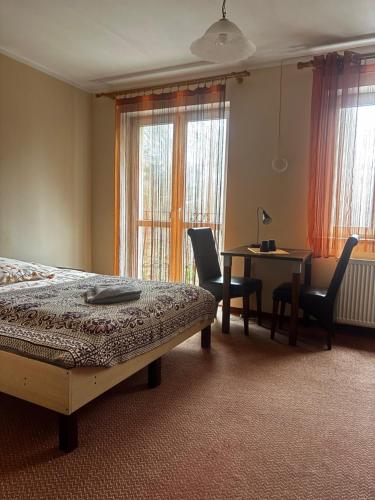 Giường trong phòng chung tại Gościniec Wstąp TU