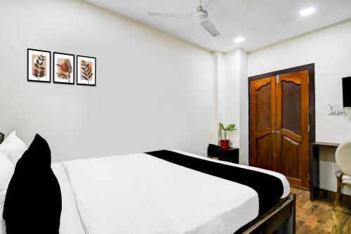 En eller flere senge i et værelse på Hotel O SPRINGWOODS HOSPITALITY