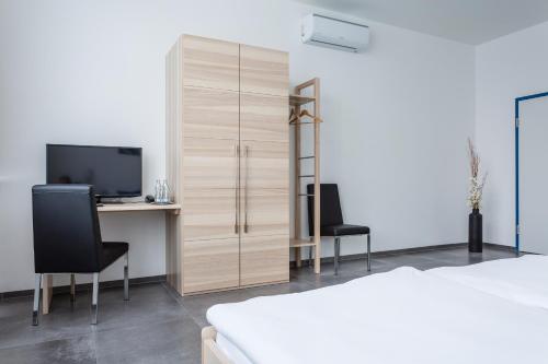 Postel nebo postele na pokoji v ubytování Turmöl Hotel