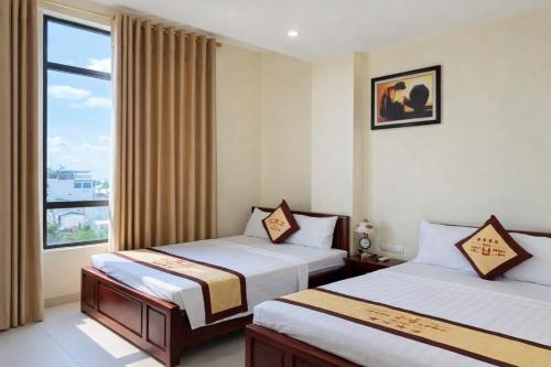 Postel nebo postele na pokoji v ubytování Thăng Long Hotel Thanh Hoá