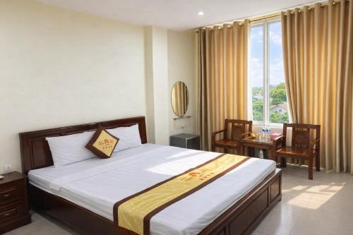 Postel nebo postele na pokoji v ubytování Thăng Long Hotel Thanh Hoá