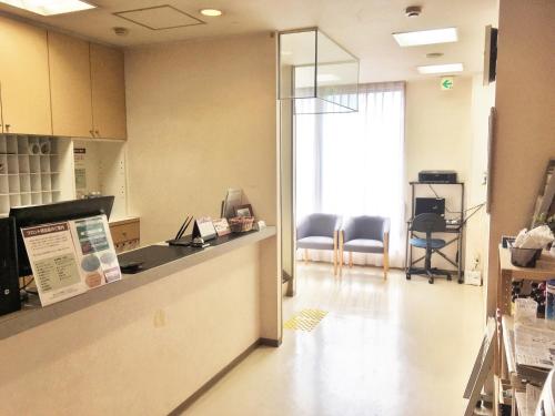 an office with a reception counter and a waiting room at Hotel Tajimi Hills Myroom in Tajimi