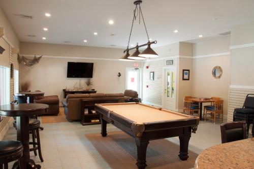 a living room with a pool table in it at Sea Pines Loft Park Model 5 in Swainton