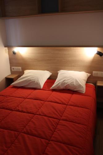 En eller flere senge i et værelse på Oasis bora bora 4 personnes