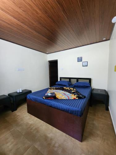 En eller flere senge i et værelse på Talia Farm house