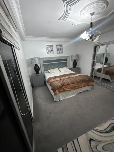 Postel nebo postele na pokoji v ubytování Hebergement centenaire