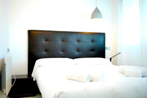 En eller flere senge i et værelse på Plaza de España View with Terrace