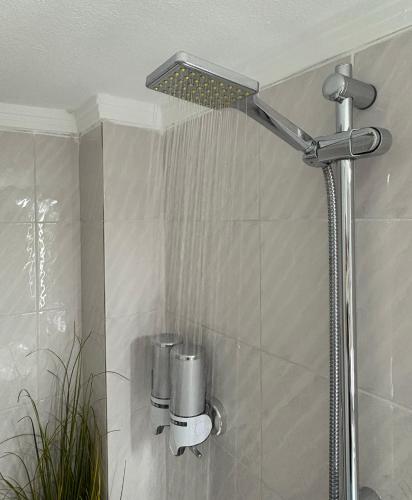 a shower with a shower head in a bathroom at Zoel's House in Chalkidiki in Agia Paraskevi