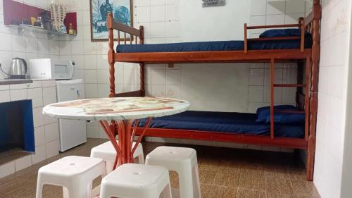 En eller flere senge i et værelse på Próximo das 42 Praias