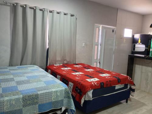 En eller flere senge i et værelse på Maravilhoso loft beira mar