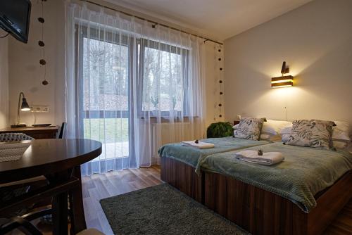 Postel nebo postele na pokoji v ubytování Ośrodek Szkoleniowo-Wypoczynkowy u Leśników