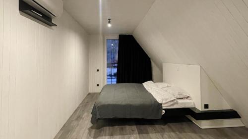 a bedroom with a bed in a attic at Rancho in Ladyzhyn