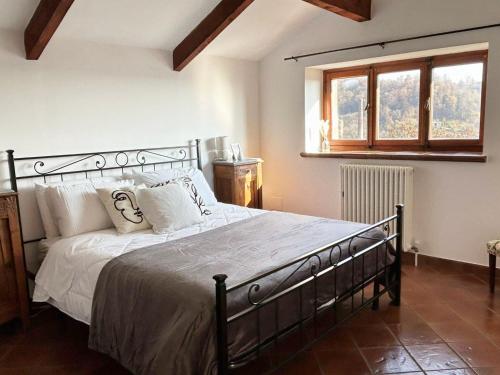 Giường trong phòng chung tại QuickHome Bianca Luce