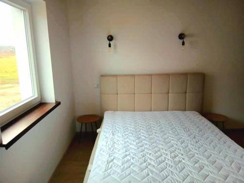 Giường trong phòng chung tại Spokojna Dolina