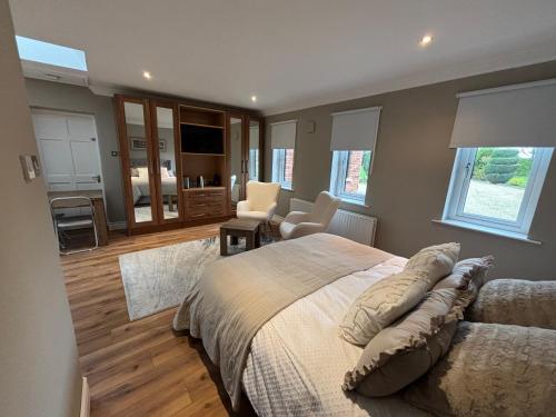 a bedroom with a bed and a living room at River Court