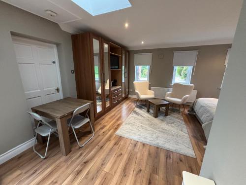 a bedroom with a bed and a table and chairs at River Court