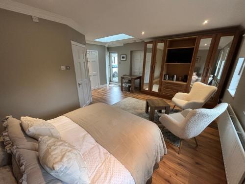 a bedroom with a bed and a living room at River Court