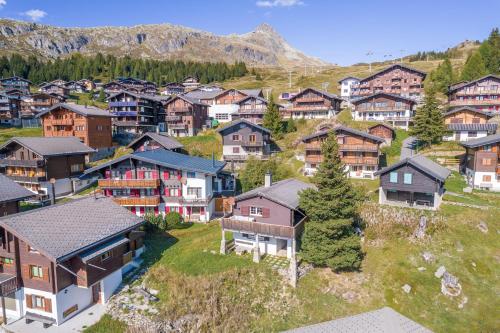 an aerial view of a village with houses at Chalet Mazze in Bettmeralp