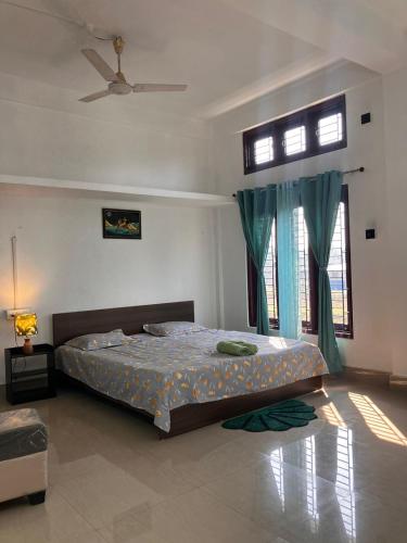 a bedroom with a bed and a window at Green Stay , AC room in Sibsāgar