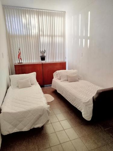 En eller flere senge i et værelse på Estilo y confort en San Nicolás