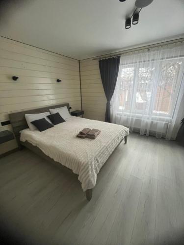 Postel nebo postele na pokoji v ubytování Між Тростяном та рікою