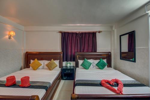 Postel nebo postele na pokoji v ubytování Siem Reap Pub Hostel