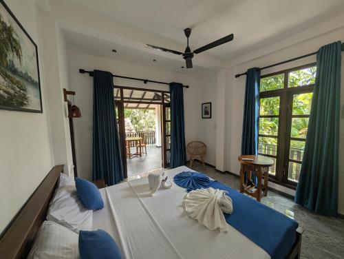 Postel nebo postele na pokoji v ubytování Little Villa Habaraduwa