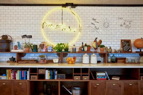 a kitchen with a shelf with fruits on it at Max Brown Hotel Midtown, part of Sircle Collection in Düsseldorf