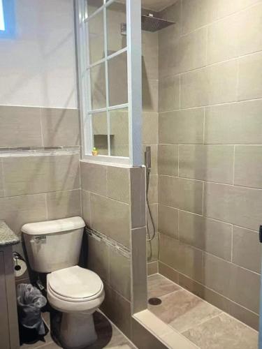 a bathroom with a toilet and a window at Koror ocean view in Koror