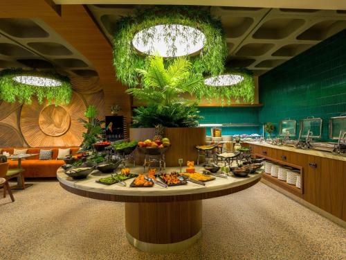 a buffet line with food on a table in a restaurant at ibis Styles Istanbul Kurtkoy in Istanbul