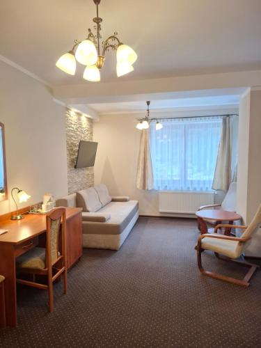 Giường trong phòng chung tại Hotel Diament