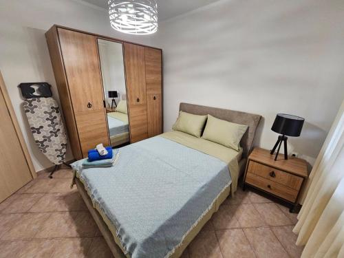 Postel nebo postele na pokoji v ubytování Kouros Cozy Home II