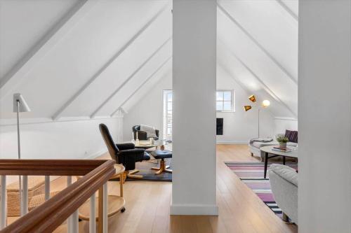 an attic living room with a white ceiling at LL264-Bagenkop-Faergevej-9-1-th in Bagenkop