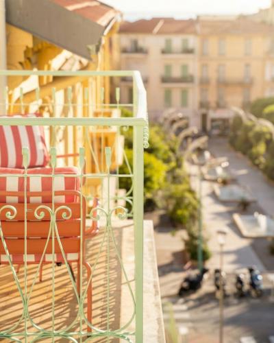 a view of a balcony with a view of a city at Hôtel Gabriel in Menton