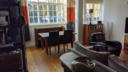 a living room with a couch and a table at St Davids House in Cranbrook
