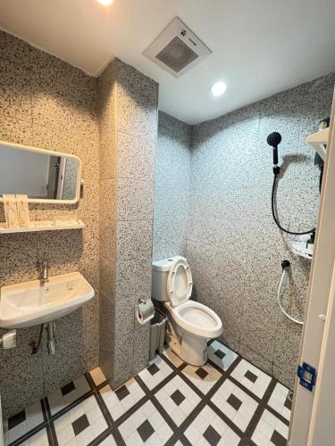 a bathroom with a toilet and a sink at Patong Beach Verve in Patong Beach