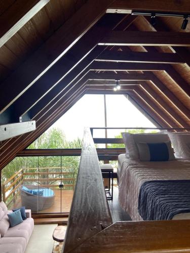 En eller flere senge i et værelse på Refúgio na Rocha - Chalé