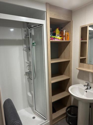 a bathroom with a shower and a sink at Horizon Bay in Longniddry