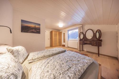 a bedroom with two beds and a window at Katja's Loft in Neustift im Stubaital