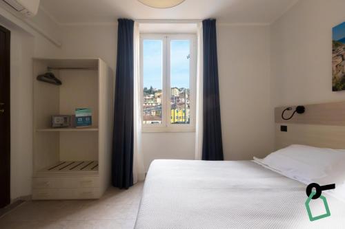 Postel nebo postele na pokoji v ubytování Hotiday La Spezia Centrale