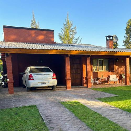 a car parked in the garage of a house at Casa Quinta Chascomús in Chascomús