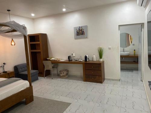 En eller flere senge i et værelse på Hotel FIrdou