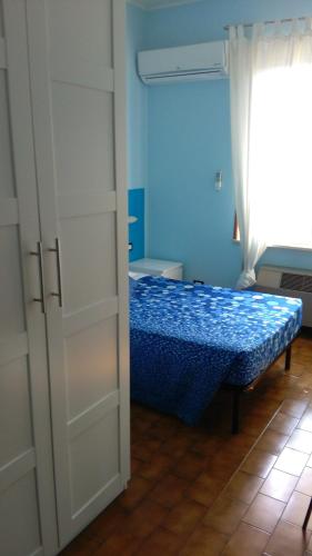 Ένα ή περισσότερα κρεβάτια σε δωμάτιο στο La Quercia Hotel con Ristorante