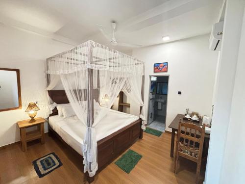 En eller flere senge i et værelse på Sunset view cabana