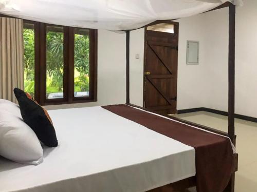 Giường trong phòng chung tại Paddy Field View Lodge Sigiriya