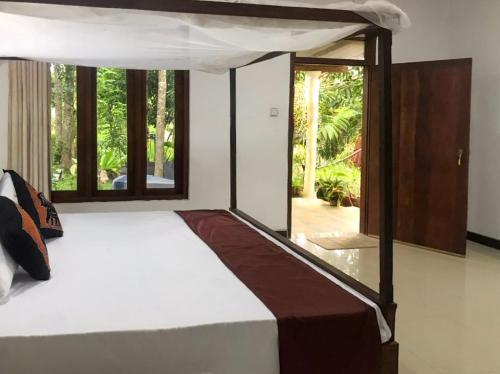 Giường trong phòng chung tại Paddy Field View Lodge Sigiriya