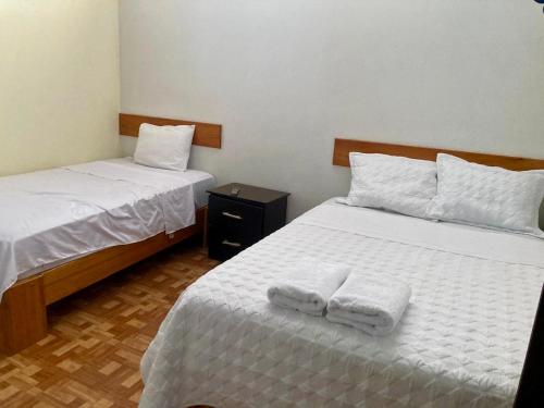 En eller flere senge i et værelse på Cabaña Familiar del lago - Sauce