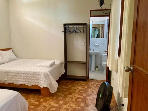 En eller flere senge i et værelse på Cabaña Familiar del lago - Sauce